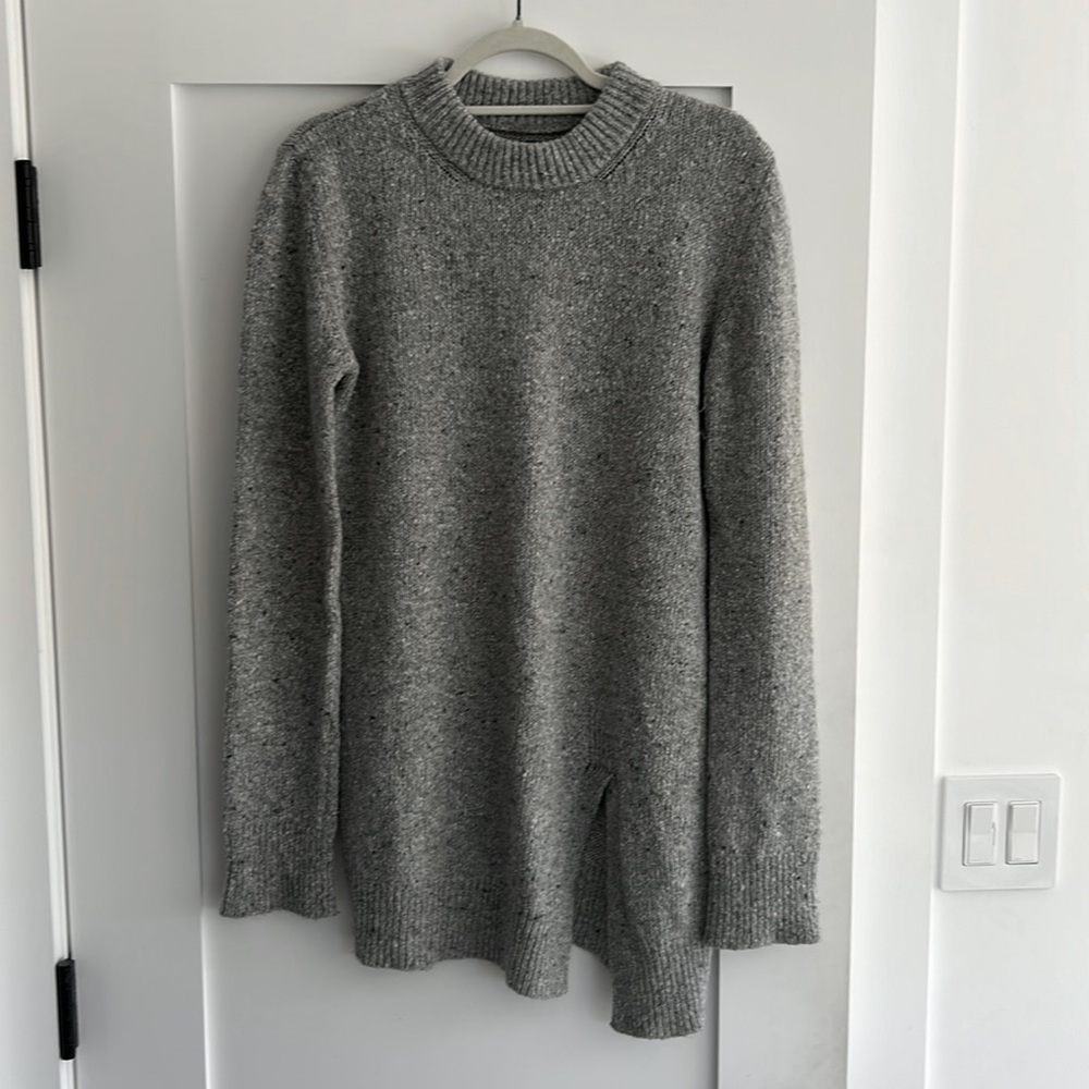 Grey tunic sweater with asymmetrical front slit detail
